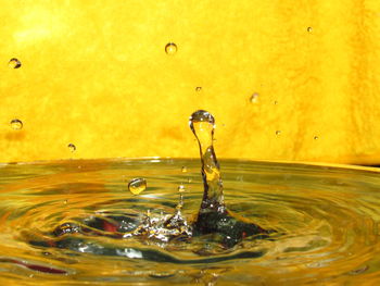 Close-up of drop splashing in water