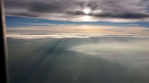 Scenic view of sea against cloudy sky