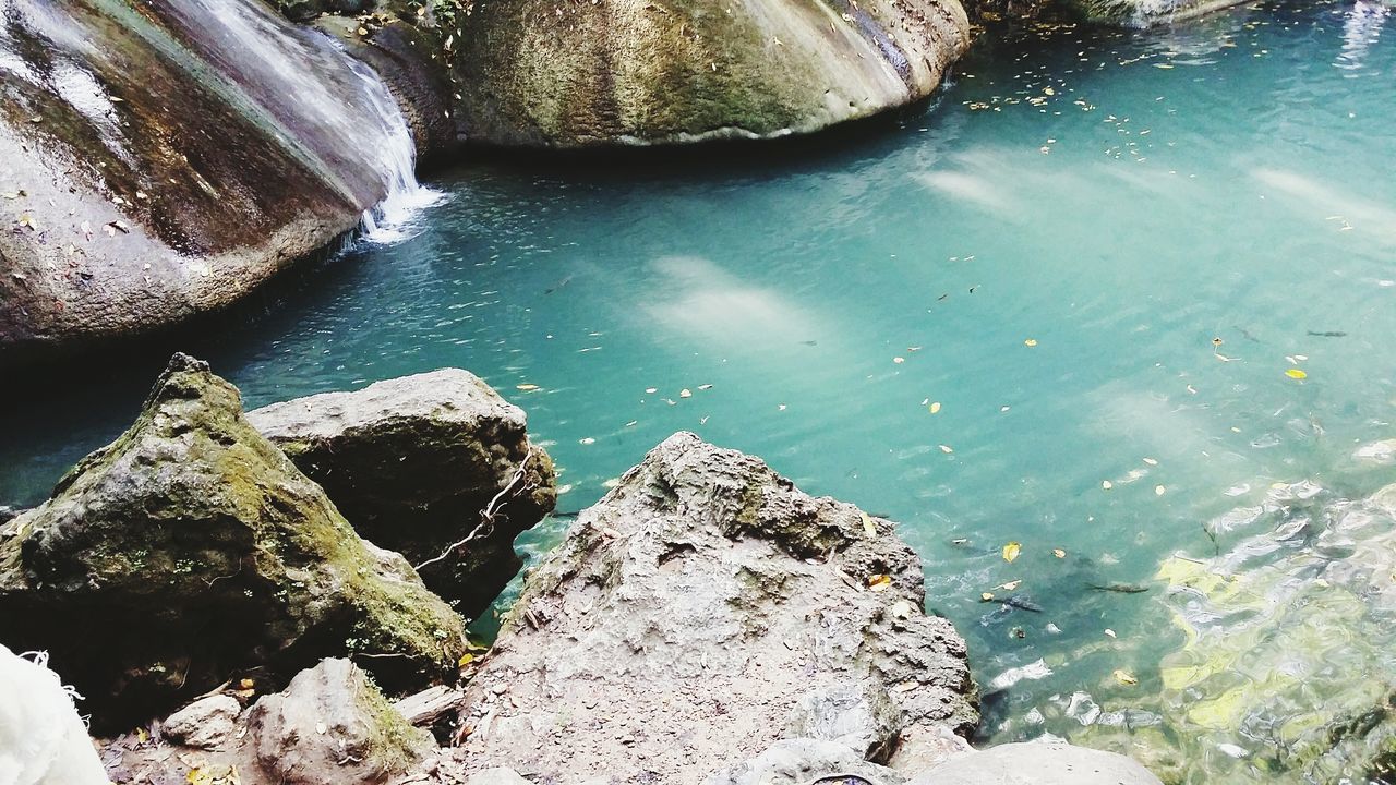 water, rock - object, nature, beauty in nature, tranquility, high angle view, reflection, sea, day, scenics, outdoors, tranquil scene, stone - object, wet, no people, rock, rock formation, idyllic, transparent, textured