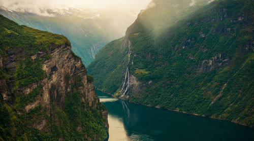 Scenic view of river amidst mountains