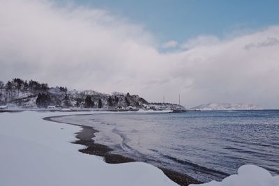 Scenic view of sea against sky during winter