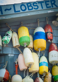 Low angle view of buoys on wall