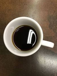 High angle view of coffee cup on table