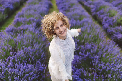 Portrait of woman enjoying on lavender field