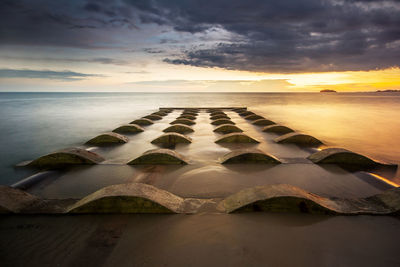 Scenic view of sea against sky at sunset