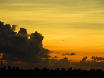 Scenic view of silhouette landscape against sky during sunset