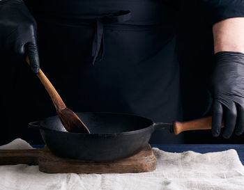 Midsection of man preparing food