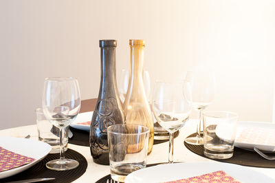 Close-up of wine glasses on table