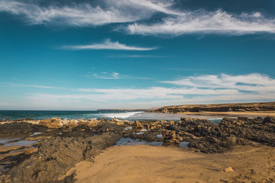 Scenic view of beach against sky