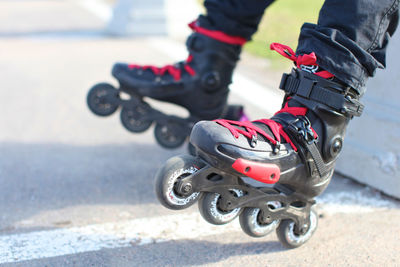 Low section of woman wearing roller skates