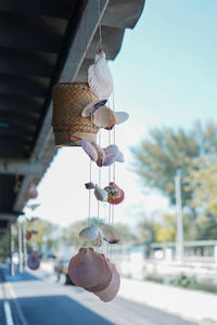 Close-up of lantern hanging against building in city