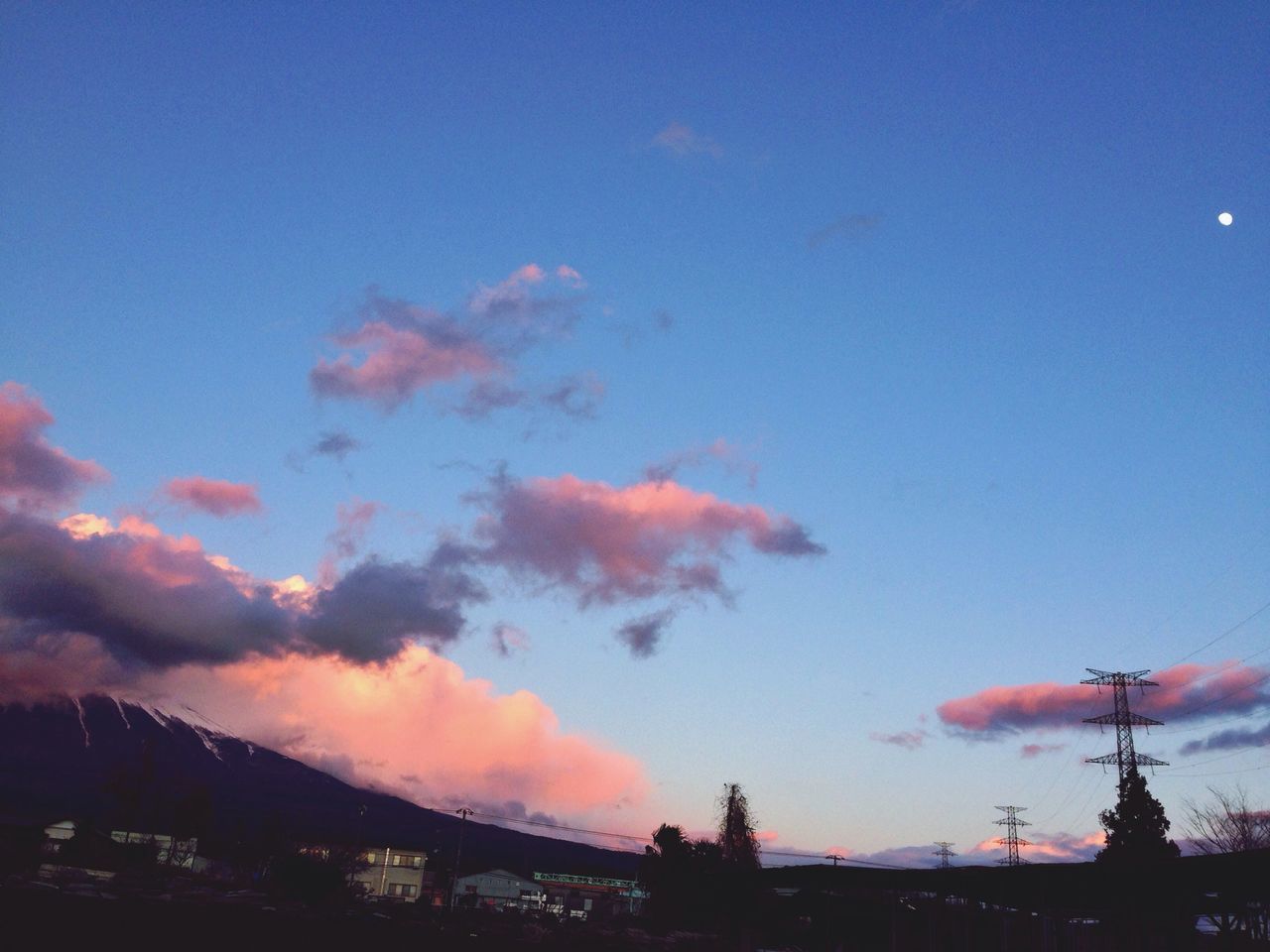 sky, low angle view, silhouette, sunset, built structure, blue, architecture, cloud - sky, building exterior, scenics, beauty in nature, dusk, nature, tranquility, outdoors, copy space, cloud, no people, tranquil scene, orange color