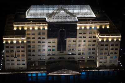 Buildings in city at night