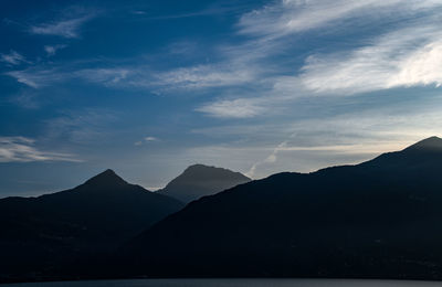 Scenic view of silhouette mountains against sky during sunset