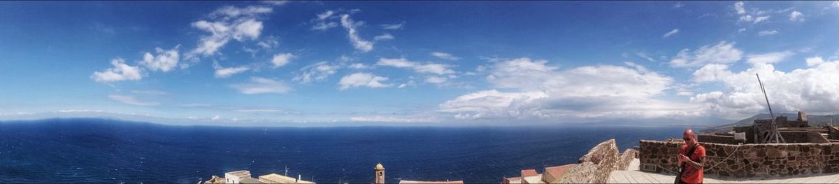Scenic view of sea against cloudy sky
