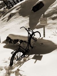 Close-up of bicycle on sand