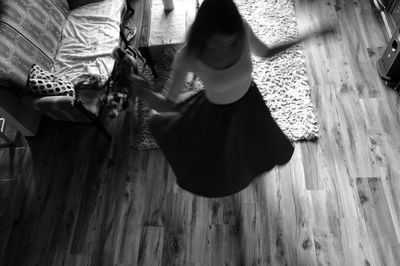 Low section of girl on wooden floor