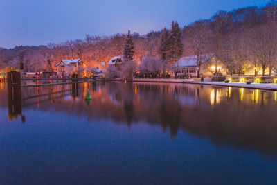 Scenic view of lake against sky at dusk