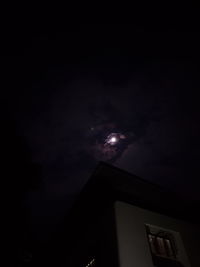 Low angle view of moon against sky at night