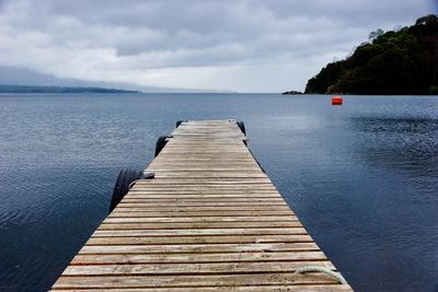 Pier over sea against sky