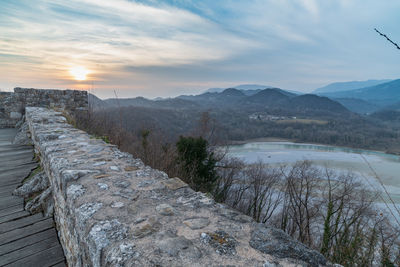 Sunset on the ancient castle of ragogna, italy. fortress guarding the ford on the river tagliamento