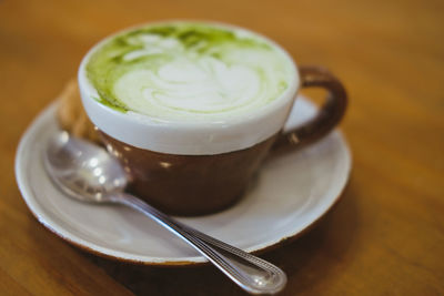 Close-up of coffee cup on table