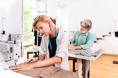 Fashion designers working at boutique