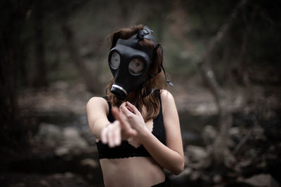 Woman wearing gas mask