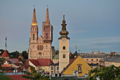 View of buildings in town against sky