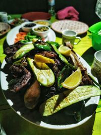 High angle view of fruits in plate on table