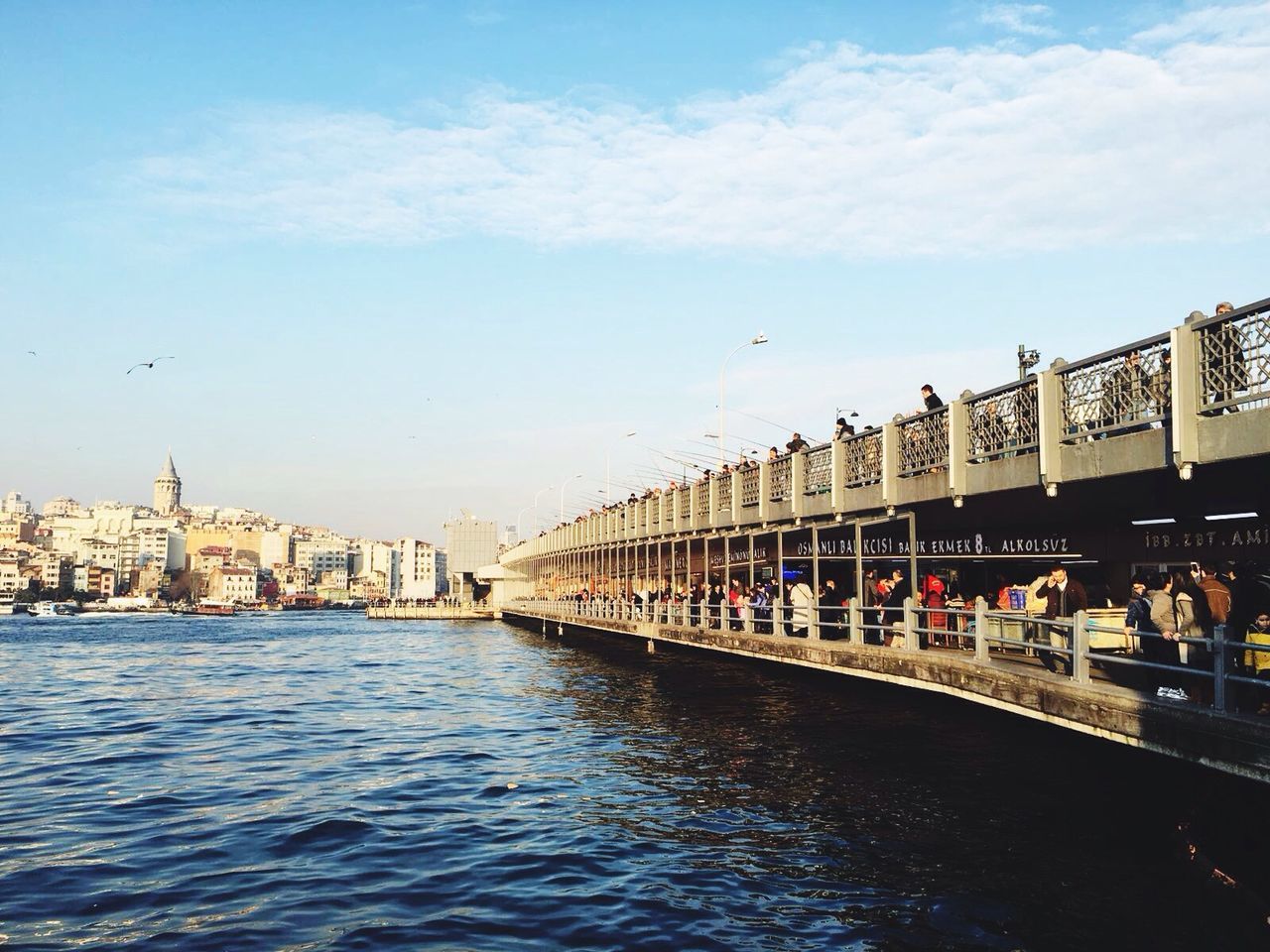 architecture, built structure, building exterior, water, sky, waterfront, city, travel destinations, incidental people, transportation, river, tourism, city life, famous place, travel, cloud - sky, capital cities, large group of people, day, cloud