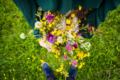 High angle view woman holding bouquet 