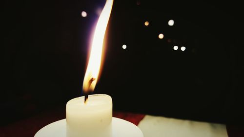 Close-up of lit candle