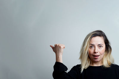 Portrait of woman against white background