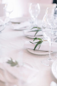 Close-up of place setting on white table