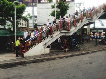 Side view of man cycling on street