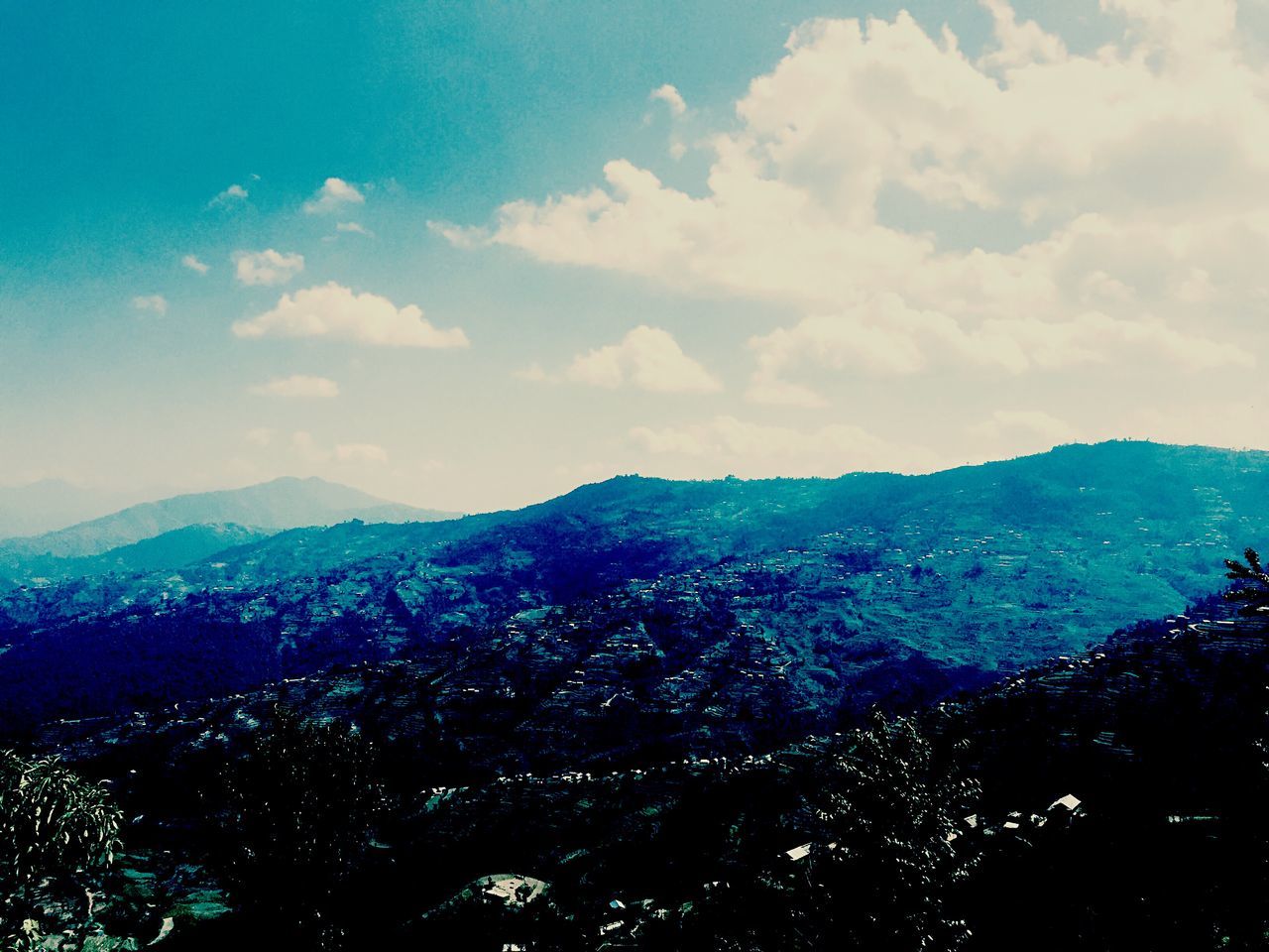 mountain, mountain range, scenics, sky, landscape, beauty in nature, tranquil scene, cloud - sky, tranquility, high angle view, nature, aerial view, cityscape, cloud, idyllic, blue, building exterior, outdoors, city, no people