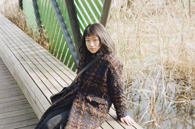 Portrait of woman sitting on seat