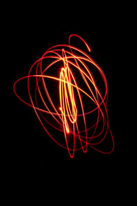 Close-up of light painting against black background