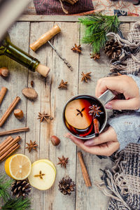 Cropped hand of woman holding christmas decoration