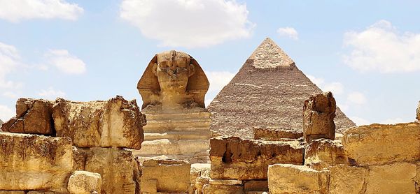 Old ruins of temple against cloudy sky