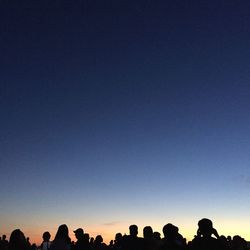 Low angle view of silhouette trees against clear sky