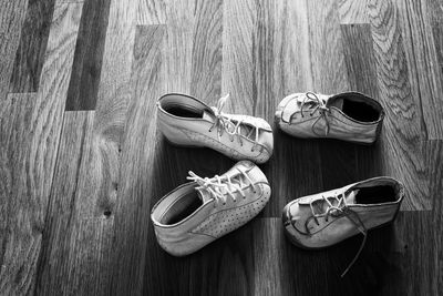 High angle view of shoes on hardwood floor