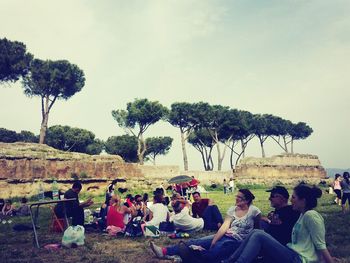 People relaxing in amusement park