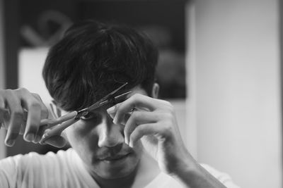 Close-up portrait of woman holding hands