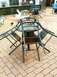 View of an empty chairs and tables in street