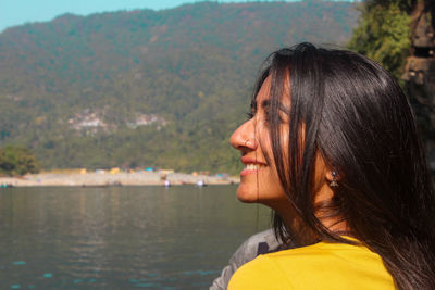 Portrait of young woman in lake