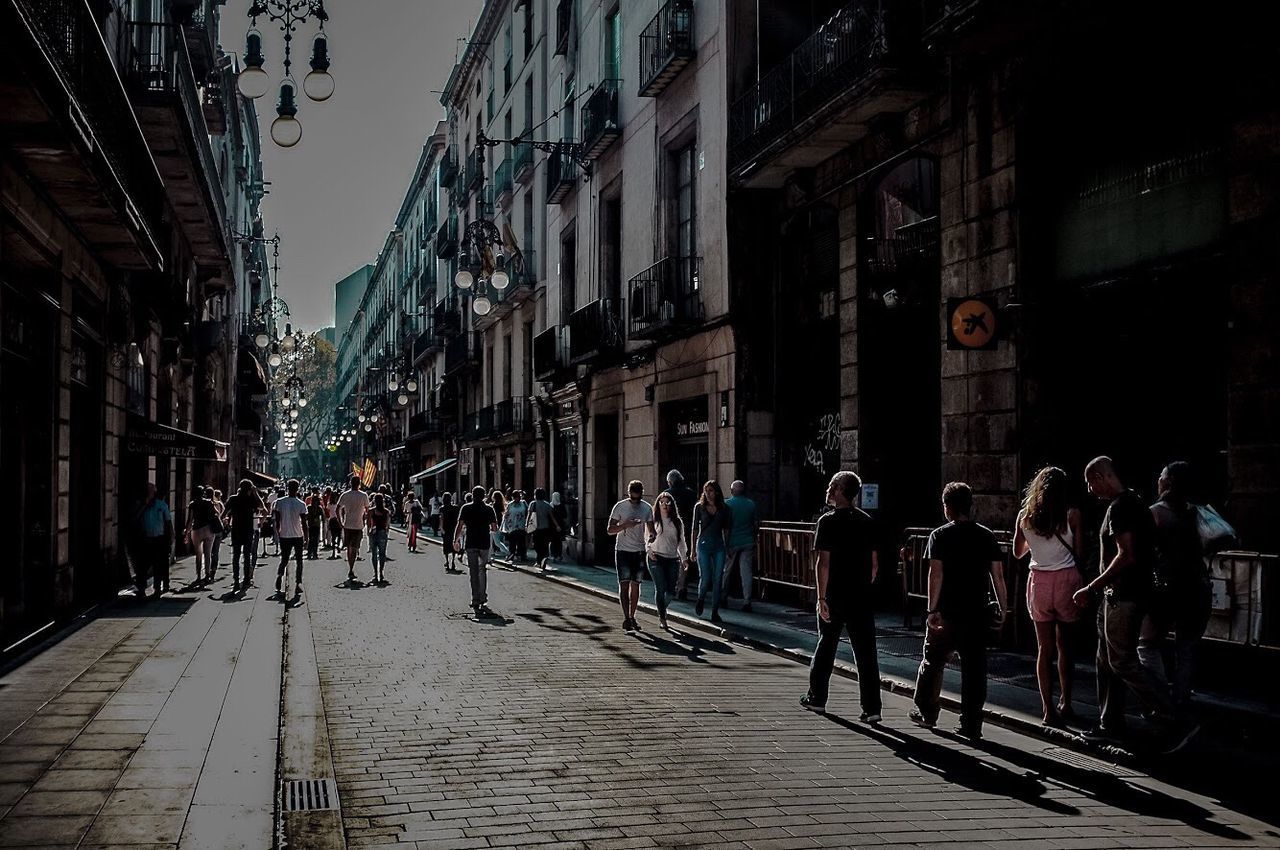 PEOPLE ON STREET IN CITY