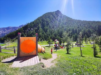 Scenic view of field against clear blue sky