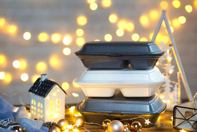 Close-up of illuminated candles on table